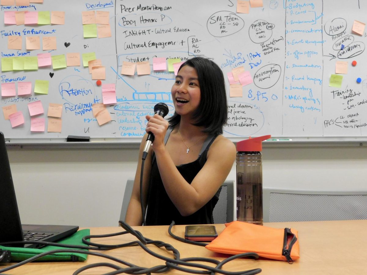 OHANA Nights Coordinator and Peer Academic Coach of the Asian American Resource Center Blessing Coranez sings a karaoke version of “Who am I” from “Tarzan 2” at the AARC ’s OHANA Game Day event on Tuesday. OHANA is a weekly program that meets at 5 p.m. Tuesdays to achieve academic and leadership success. (Sofia Howell | Northern Star)