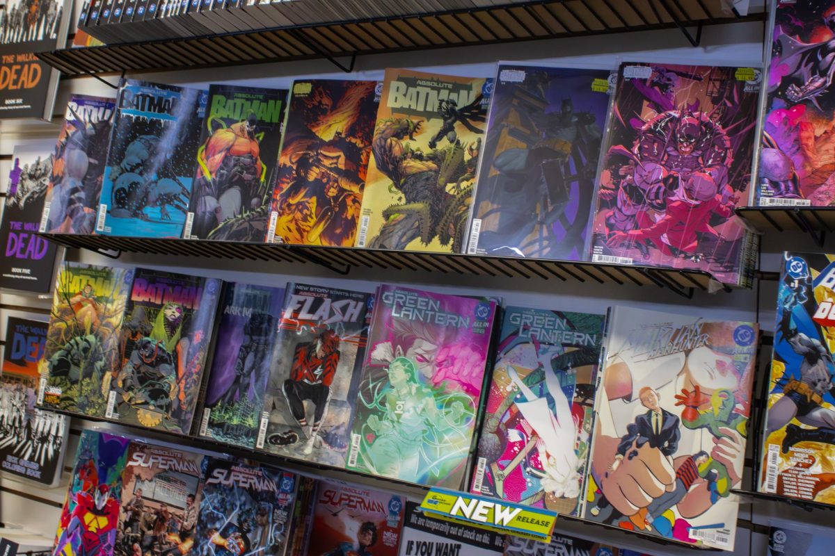 Shelves in Graham Cracker Comics sits lined with several issues of the Absolute Batman series. Absolute Batman has been one of the company’s best selling comics. (Ethan Rodriguez | Northern Star)