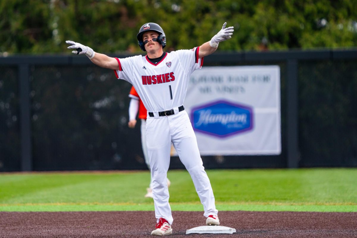NIU baseball senior second baseman Cole Smith celebrates his double hit in the bottom of the first inning against Bowling Green State University on March 29. Smith leads the team with a .380 batting average in his first season with the Huskies. (Northern Star file photo)