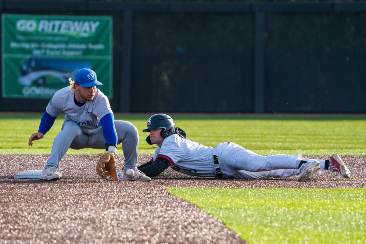 NIU baseball senior designated hitter Will Couchman steals second base in the bottom of the eighth inning against Eastern Illinois University on Tuesday at Ralph McKinzie Field at Walt and Janice Owens Park. Couchman had two of the five total Huskie stolen bases against the Panthers, setting his season high. (Eric McGill | Northern Star)