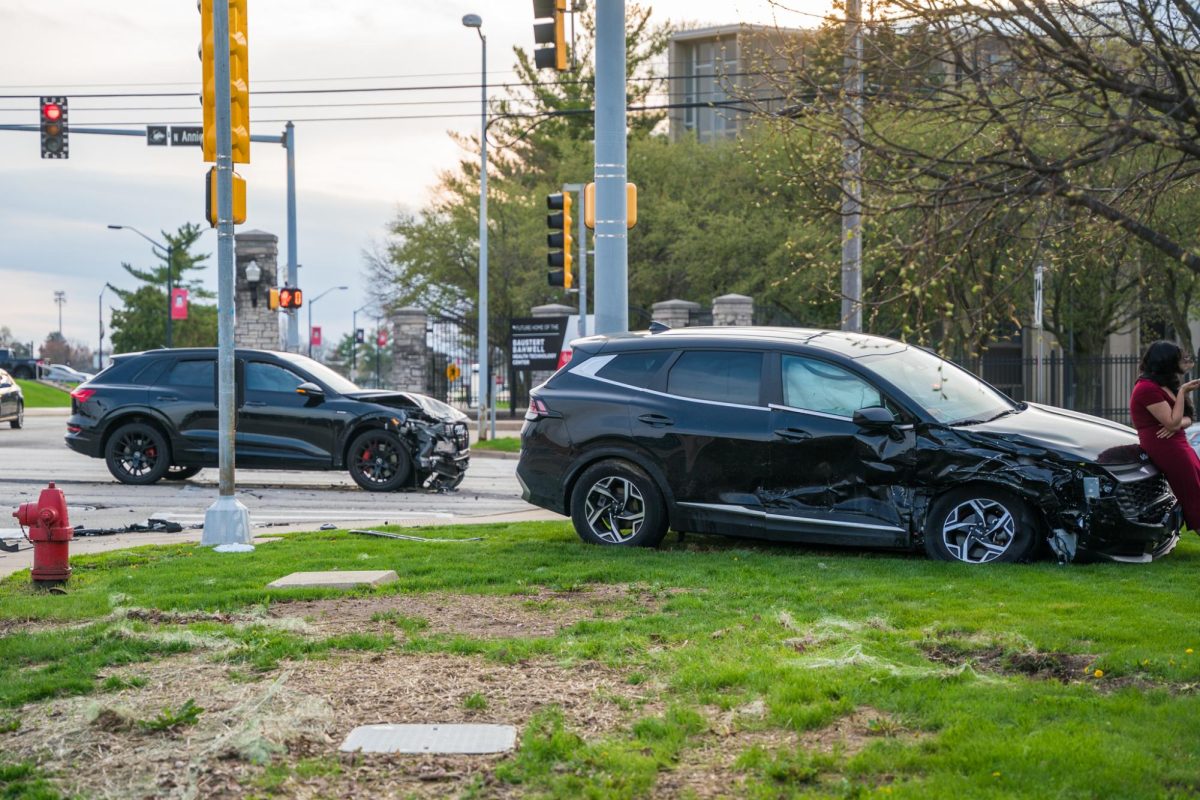 A damaged Kia crossover sits off-road. At approximately 6:20 p.m., a car accident occurred on Lucinda Avenue and Annie Glidden Road, outside the NIU Recreation Center. (Eric McGill | Northern Star) 