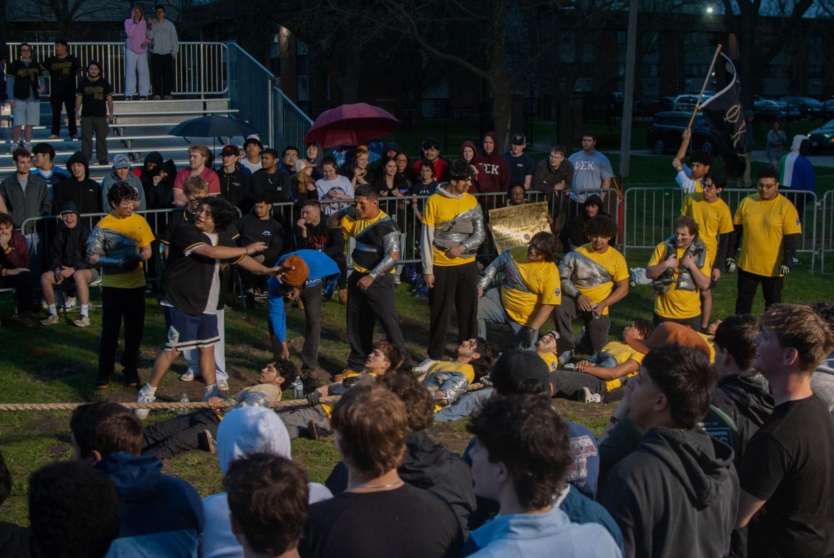 Phi Kappa Sigma fights against Tau Kappa Epsilon in the first rope of the play-in match on Sunday. Skulls was able to recover against a second rope loss after each TKE tugger left their trench in the third rope. (Aidan Penca | Northern Star) 
