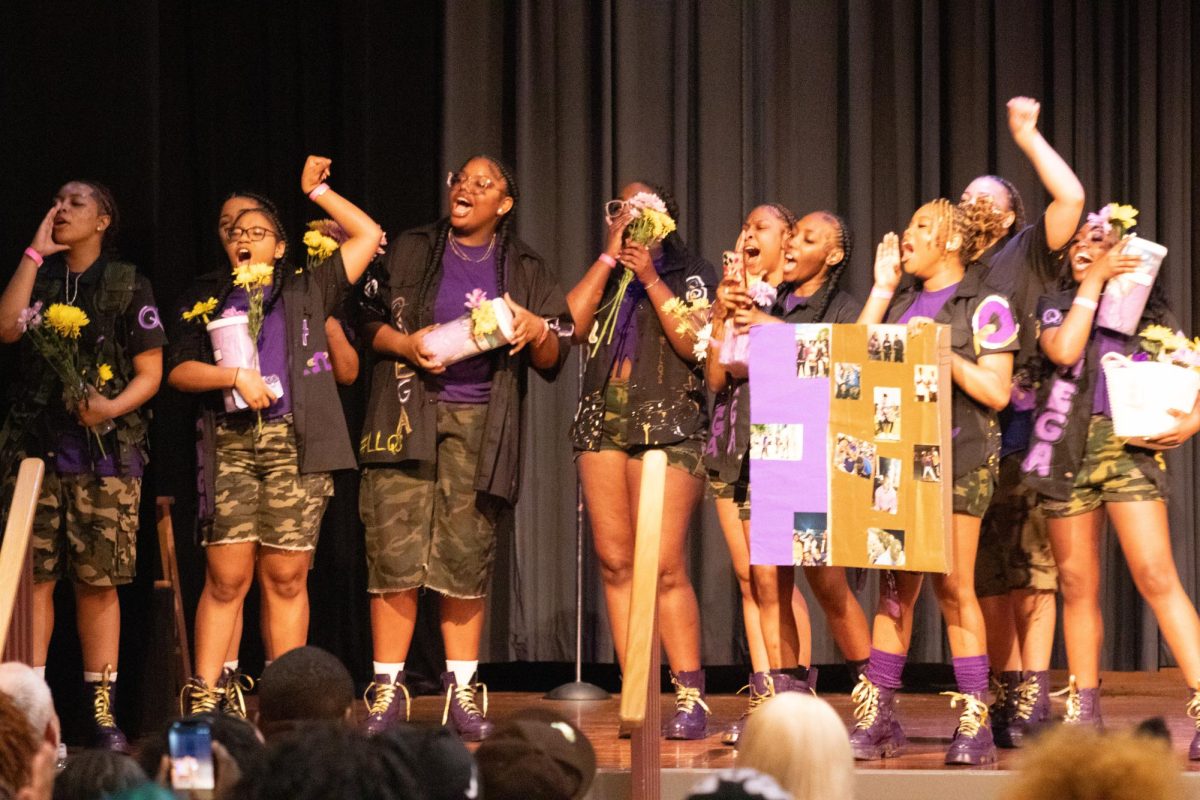 Contestants from “Crowd Control” Team gather on the stage of the Duke Ellington Ballroom to present a gift before the “Hop Like A Que” event on Friday inside the Holmes Student Center. The event took place from 7 p.m. to 9 p.m. but was halted due to a tornado warning. (Roshay Grant | Northern Star) 