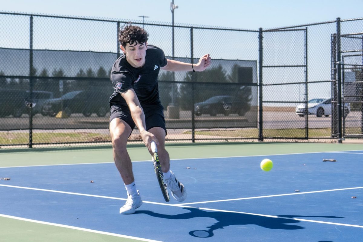 
NIU men’s tennis senior Iker Gaztambide Arrastia reaches for the ball during his singles match against the University of Toledo on March 21. Gaztamide Arrastia was named the Mid-American Conference Player of the Year on Tuesday. (Totus Tuus Keely| Northern Star)
