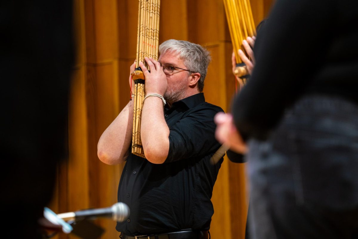 Brockton Shipley plays the khaen during “Mang Pu Tom Dok/ Ponglang Ensemble” on Tuesday in the Music Building, Boutell Memorial Concert Hall. The concert took place for two hours, starting at 7 p.m. (Eric McGill | Northern Star)