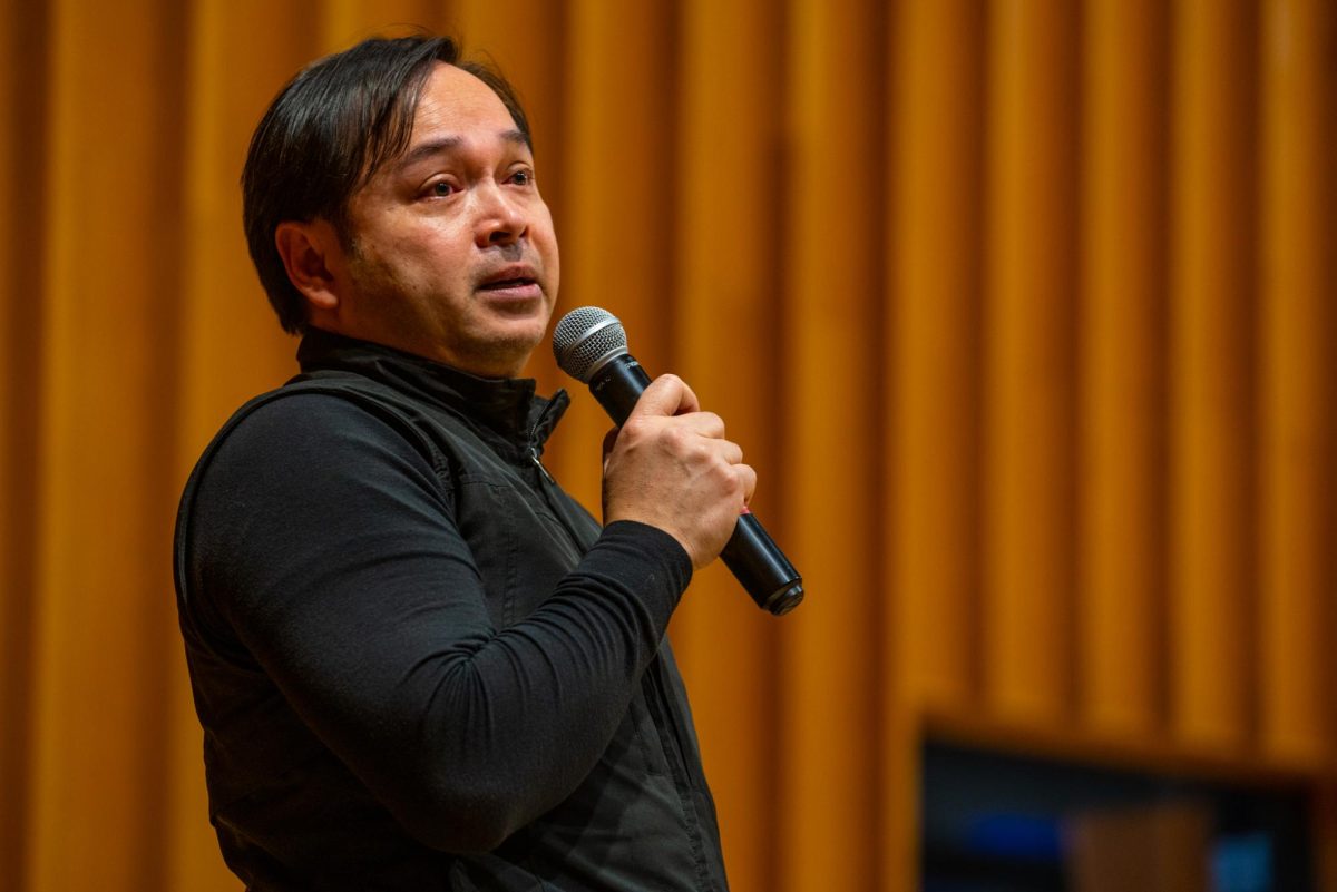 NIU Instructor Chamni Sripraram thanks the audience in between performances on Tuesday in the Music Building, Boutell Memorial Concert Hall. The final event of 2026 World Music Festival, Sonic Tapestry: Global Traditions and Cultural Crossroads, will be held at 3 p.m. on Saturday in the Boutell Memorial Concert Hall. (Eric McGill | Northern Star)