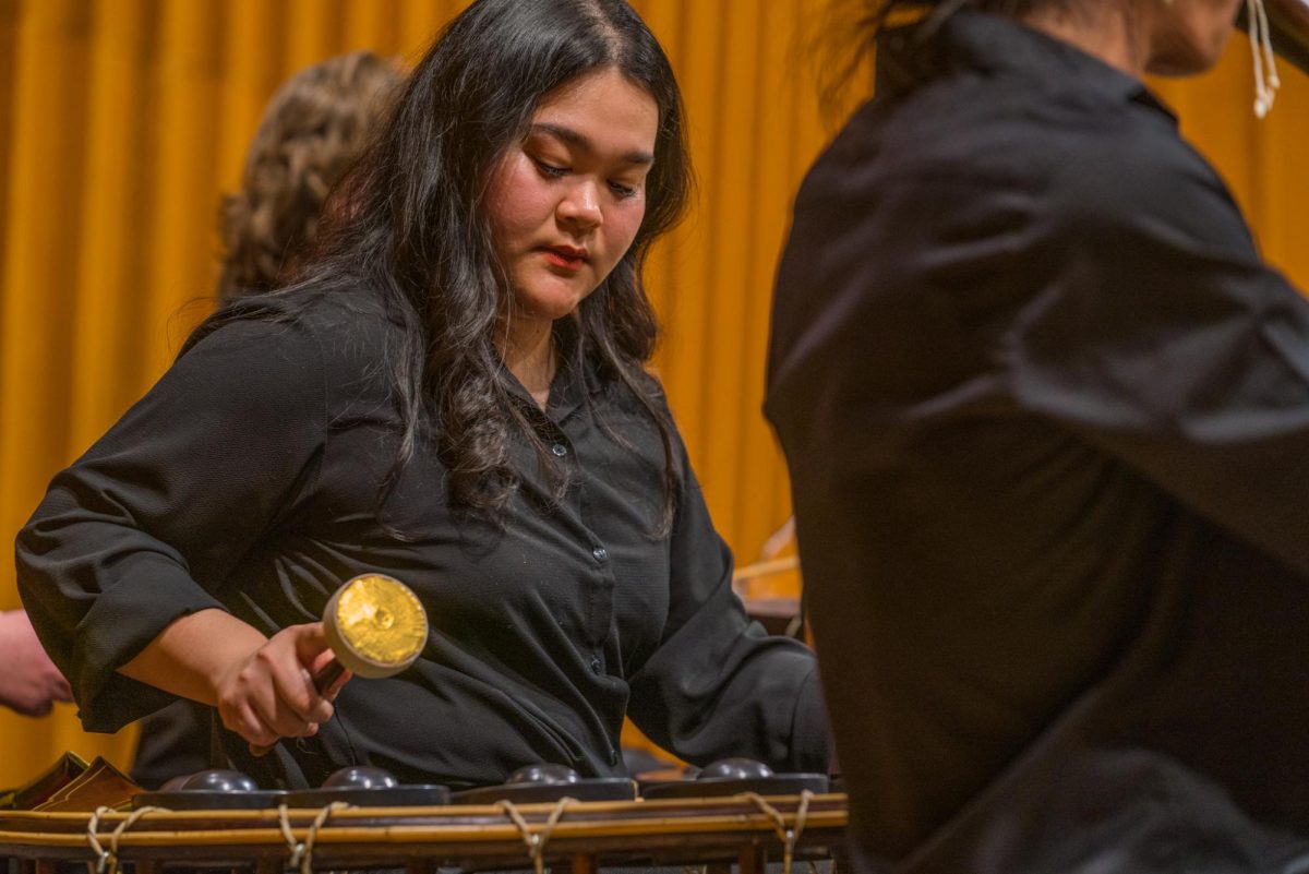 Patcharita Pankaew performs “Mulung / Piphat Mai Naum” on the khwang wong yai on Tuesday in the Music Building, Boutell Memorial Concert Hall. The Recital Hall will also host the NIU percussion ensemble on Sunday, with a general public entry fee of $7 and free entry for NIU students. (Eric McGill | Northern Star)