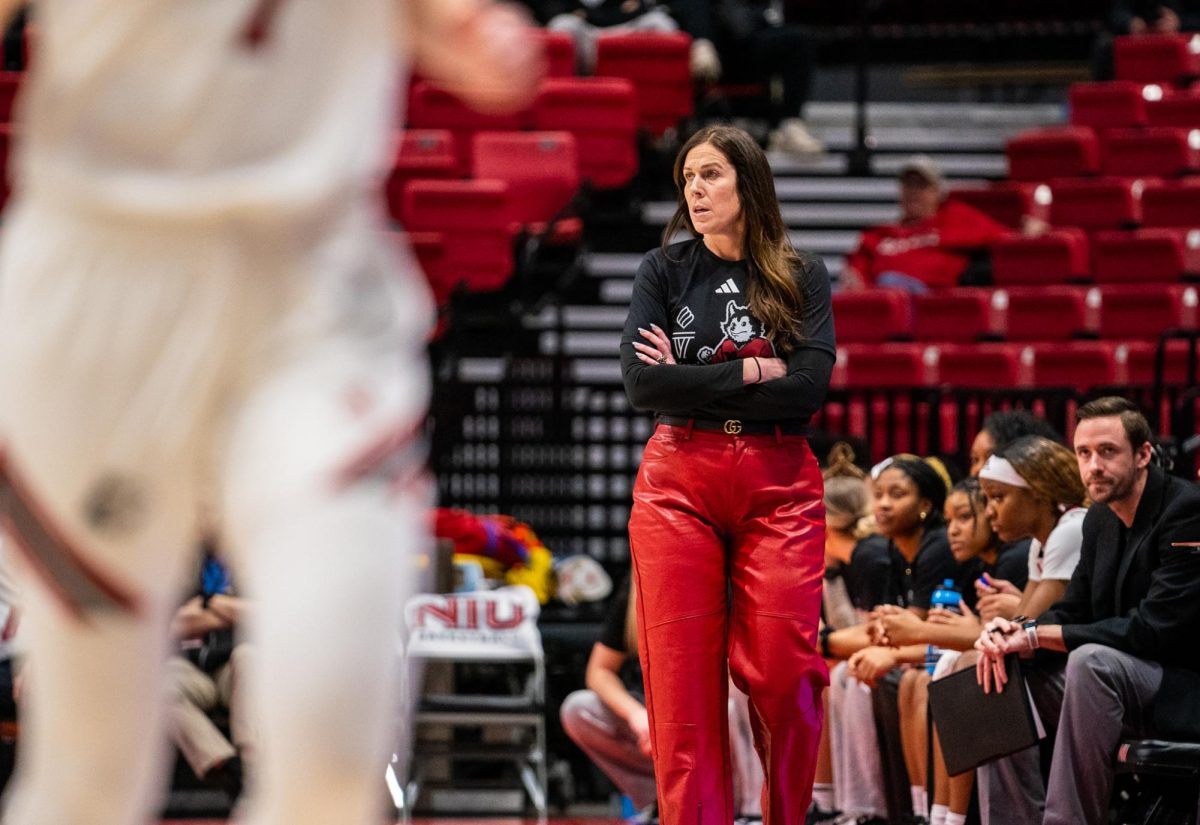 NIU women’s basketball head coach Jacey Brooks watches the Huskies take on the Texas State University Bobcats on February 7. After her first season at the helm, Brooks’ reflected on the team's growth and goals in the offseason. (Northern Star file photo)