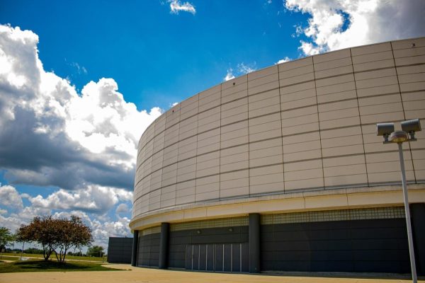 Clouds roll past the Convocation Center. On July 1, the Convocation Center began an administrative transition from Intercollegiate Athletics to the Division of Student Affairs. (Northern Star File Photo)